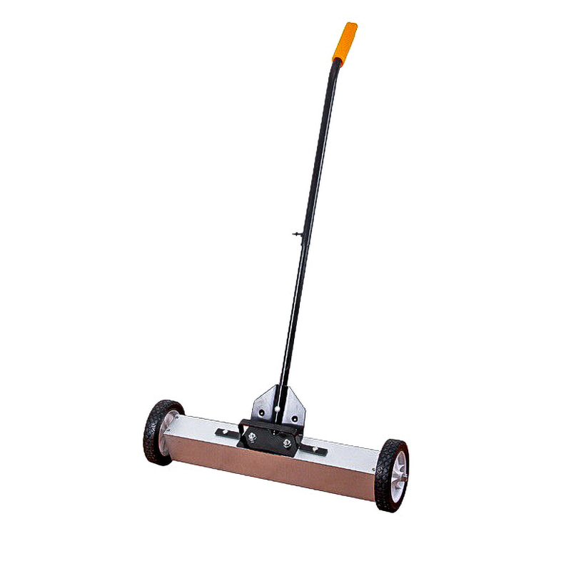 Commercial magnetic sweeper operating on an industrial floor